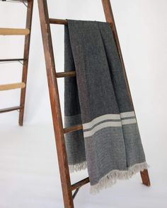 a ladder that has a blanket on it