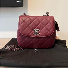 Preloved Chanel Burgundy Caviar Leather Waiter Bag With Ruthenium Hardware. Overall Excellent Condition Comes With Full Set Minus Receipt. You Can Wear Her Crossbody Or Pull The Handle Through And Wear Her Over The Shoulder. Measurements Are: Shoulder Strap Drop Max: 25" Shoulder Strap Drop Min: 13" Height: 6" Width: 7" Depth: 3" Designer Burgundy Bag With Detachable Strap, Luxury Red Flap Bag With Removable Pouch, Red Bags With Detachable Strap For Everyday Luxury, Chic Red Bags For Everyday Luxury, Luxury Burgundy Bag With Detachable Strap, Luxury Burgundy Crossbody Shoulder Bag, Luxury Burgundy Crossbody Bag, Luxury Burgundy Evening Bag, Chanel Bag