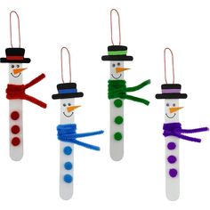 four snowmen made out of toothpicks with different colors