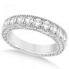 a white gold wedding ring with five diamonds