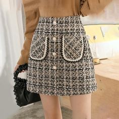 Silhouette: Pencil Gender: WOMEN Waistline: Empire Pattern Type: Plaid Material: Acetate, Cotton, Polyester Style: Elegant color: Black, Khaki Size: S,M,L,XL Length: Mini Skirts Size (cm) Waist Width Hip Width Skirt Length S 64.0 84.0 36 M 68.0 88.0 37 L 72.0 92.0 38 XL 76.0 96.0 39 Size (inch) Waist Width Hip Width Skirt Length S 25.20 33.07 14.17 M 26.77 34.65 14.57 L 28.35 36.22 14.96 XL 29.92 37.80 15.35 Plaid Mini Skirts, Tweed Skirts, Skirts Plaid, Velvet Pleated Skirt, Plaid Wool Skirt, Mini Pencil Skirt, Party Dress Long Sleeve, Satin Midi Skirt, Tweed Skirt