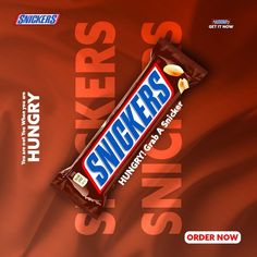 a bar of snickkers sitting on top of a red background