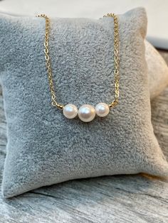 "7-7.5mm and 5-5.5mm White rose tone Akoya Culture Pearl (from Japan) in 14K Gold filled or Serling silver chain Beautiful Elegant and Classic look. Perfect gift for any occasion Holidays, Birthday or just something nice as a gift ◈ Handmade in the U.S.A. ◈ Akoya Culture Pearl: 1 / 7-7.5mm and 2 / 5-5.5mm white rose tone pearls ◈ Metal: 14K gold filled or sterling silver ◈ Chain Length:15\" 16\" 17\" 18\" 19\" 20\" free shipping and a gift 🎁 My jewelry will be wrapped in a beautiful gift box re Rose Gold Akoya Pearl Necklace Gift, Rose Gold Pearl Necklace With Round Beads For Gift, Pearl Bar Necklace, Necklace Friendship, Bar Necklaces, Akoya Pearl Necklace, Rose Tone, Cultured Pearl Necklace, Black Bead Necklace