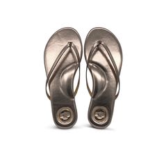 Indie Metallic Pewter Sandal Classic Flip Flops With Textured Footbed, Classic Flip Flops With Textured Footbed And Toe Post, Classic Toe Post Flip Flops With Textured Footbed, Cushioned Single Toe Strap Flip Flops, Classic Sandals With Ortholite Insole, Classic Flip Flops With Cushioned Footbed, Classic Adjustable Flip Flops With Single Toe Strap, Everyday Summer Flip Flops With Arch Support, Classic Open Toe Flip Flops With Cushioned Footbed