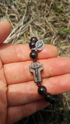 +. This is a Wooden Rosary Bracelet. +.It is knotted bracelet and it is adjustable . +.The crufix is carved in elevorate and three dementional shape. +.+.+.+.+. Materials +.+.+.+.+.+. Cross: Mpingo(Africa black wood) Beads : black wood +.+.+.+.+. Size +.+.+.+.+. Cross : 13.3mm(Width) *20mm(Height) Beads: 8mm +. Carved characters(e.g. baptismal name, name,etc) on back side +. please send me characters that you want. It's Free engraving +.Lead time is 3-7 business days. +.Delivery is currently bei Adjustable Wooden Beads Rosary Bracelet Gift, Adjustable Wooden Bead Rosary Bracelet Gift, Gift Rosary Bracelet With 8mm Beads And Crucifix, Knotted Rosary, Mens Rosary, Wooden Rosary, Knotted Bracelet, Bracelet Christmas, First Communion Gifts