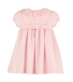 The Casero & Associates Silverstone Flower Smock Dress in Pink is the perfect dress for your little girl. With its delicate smocked design and charming ruffle collar, your baby or toddler will be the epitome of elegance. Make them feel like a true princess in this pretty in pink dress. Pink Dresses With Ruffled Collar For Spring, Elegant Smocked Ruffle Dress For Baptism, Pink Smocked Dress With Ruffle Hem For Garden Party, Spring Dress With Ruffled Collar For Dress-up, Elegant Pink Dress With Smocked Cuffs, Pink Smocked Bodice Dress For Dress-up, Spring Smocked Dress With Ruffled Collar And Details, Spring Smocked Dress With Ruffled Collar And Ruffles, Pink Dress With Smocked Bodice For Dress-up