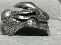 "For your consideration, a rare James Avery 3D rabbit ring. This whimsical ring which is hallmarked \"ster\" and the James Avery maker's which which is a candelabra and his initials.  This ring is 3D with a a tremendous amount of detail, down to his ears and fluffy tail. The rabbit measures  23.2mm x 12.6mm.and the band tapers to 5.5mm in the back. The rabbit stands a little over 12mm above the finger.  It is a size 8 and weighs in at a hefty 17.2 grams.  It is a unique and wonderful ring!" Whimsical Ring, 3d Rabbit, Rabbit Ring, Rabbit Jewelry, Fluffy Tail, Silver Gift Wrap, Pink Sapphire Ring, The James, James Avery