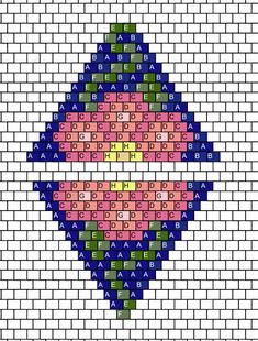 a cross stitch pattern on a white brick wall with blue, pink and green colors