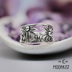 This handcrafted Sterling Silver Floral Ring has a unique botanical design that evokes the beauty of flowers. This beautiful floral Cutout Sterling Silver Band that has been gently rounded for comfortable wear. Both elegant and beautiful, spring flowers promise new beginnings. Wildflowers have been used as herbal medicines since the time of the Greeks, and have been harvested by man for thousands of years.  We include a gift box, polishing cloth and instructions for the care of this unique and b April Birth Month Flower, April Birth Month, Botanical Ring, Silk Bracelet, Promise Rings For Couples, Flower Band, Birth Month Flower, Botanical Design, Wide Ring