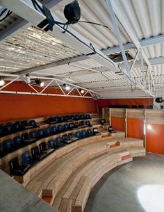 an empty auditorium filled with blue seats