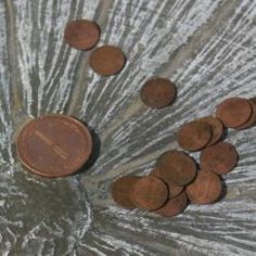 some coins are sitting on top of a table