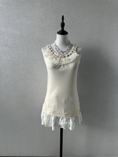 -Preloved, in great condition -Label size M, bust:79-87cm, length:61cm -Best fits uk6-8 dollete coquette balletcore kawaii harajuku dollcore fairy female jfashion grunge Elegant Tops With Lace Trim And Ruffled Straps, Fitted Cream Tank Top With Built-in Bra, Spring Cream Tank Top With Built-in Bra, Fitted Camisole With Lace Trim And Ruffled Straps, Fitted Lace Trim Camisole With Ruffled Straps, Fitted Ruffled Tank Camisole, Sleeveless Stretch Coquette Tops, Fitted Ruffle Tank Camisole, Coquette Tops With Lace Trim And Spaghetti Straps