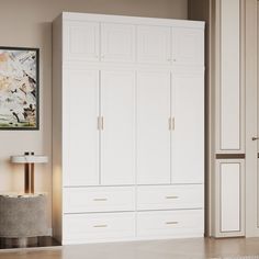 a large white closet with two doors and drawers next to a painting on the wall