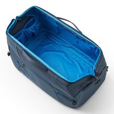 an open suitcase on a white surface with blue linings and zippered closures