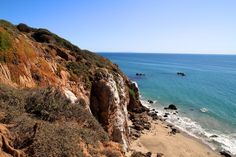 an ocean view from the top of a cliff