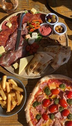 an assortment of food is displayed on a table