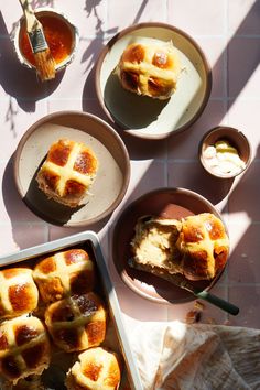 hot cross buns in bowls on a table