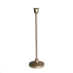 a tall metal candle holder on a white background