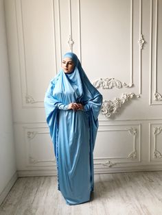 Tender light sky blue silk long khimar with high cuffs. This jilbab will be a good cover for you. Delicate fine silk ideal for summer weather. Always keep in mind that the fabric is enlightened, at the bottom have to be the dress. An elegant way for the believing women. Buttons secure the cuffs. Be sure when ordering in the note write the length of the khimar and the girth of the wrist.We can sew khimar in any other color! This handy headdress like those who do not yet know how to wind a scarf, Blue Modest Khimar For Eid, Long Blue Khimar For Eid, Blue Long Khimar For Eid, Blue Modest Long Abaya, Blue Dabka Maxi Length Abaya, Modest Long Sleeve Blue Kaftan, Long Blue Abaya For Eid, Blue Abaya For Eid, Blue Long Abaya For Eid