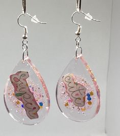 Handmade resin, tear drop earrings super cute with glitter Handmade by me Artist Brenda Gaskins  Charleston South Carolina Tear Drop Earrings, Charleston South Carolina, Charleston Sc, Tear Drop, Teardrop Earrings, Charleston, South Carolina, Jewelry Earrings Dangle, Dangle Drop Earrings