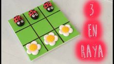 an image of a card game with ladybugs and daisies on the grid