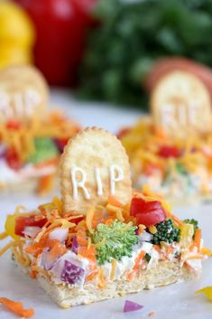 some crackers are decorated with vegetables and the word rrp is spelled on them