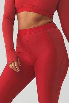 The Airlift High-Waist Ballet Dream Legging - perfect for barre and beyond. Sculpting Airlift fabric and strategic mesh panels lift and contour, while the high rise and fitting flair flatter every figure. Designed to transition seamlessly from practice to pavement in stylish comfort, this legging nails the ballerina look and feel. Sporty Alo Yoga Bottoms For Pilates, Red Compressive Activewear For Pilates, Sculpting Sporty Bottoms For Training, Alo Yoga Nylon Training Bottoms, Sporty Red Leggings For Pilates, Athleisure Activewear For Barre, Sporty Sculpting Bottoms For Pilates, Sporty Fitted Bottoms For Barre, Red Athleisure Bottoms For Pilates