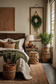 a bedroom with a large bed and two planters on the floor