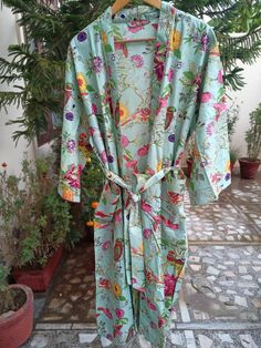 This Robe we makes from 100% Cotton printed fabric. The fabric print is Anokhi Floral which is very popular in all over the world . We use pure cotton cambric fabric . This is free One size robe . There is both side pocket in robe. Length = 120 cms. ( 48 inches) Green Bohemian Floral Robe, Traditional Cotton Digital Prints For Summer, Green Summer Sleepwear With Kimono Sleeves, Green Floral Print Sleepwear For Home, Printed Cotton Robe For Home, Blue Bohemian Sleepwear With Floral Print, Green Kimono Sleeves Sleepwear For Summer, Long Floral Print Summer Sleepwear, Blue Bohemian Floral Print Sleepwear