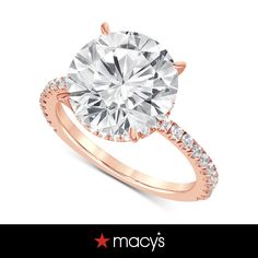 a rose gold engagement ring with diamonds on it