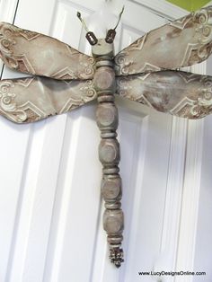 a dragonfly is hanging on the door