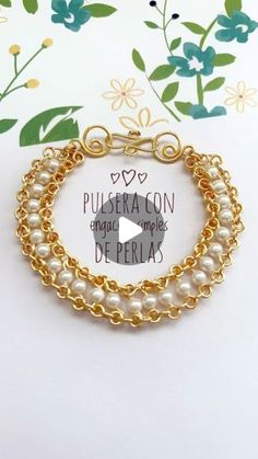 a gold bracelet with pearls on it