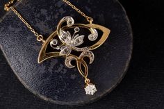 Splendid pendant on chain from the Art Nouveau era, beautifully handcrafted in 18k yellow gold set with 11 glistening rose cut diamonds set in platinum detailed with fine mille grain, dating circa 1890's. Condition: Very good. Period: Art Nouveau era circa 1890s Material: Pendant is 18k yellow gold with a platinum top layer, the later adapted chain is made in 18K yellow gold, acid tested. Weight: 6.4 gram Diamonds: 11 glistening rose cut diamonds of various size. Dimensions: the pendant measures Period Art, Art Nouveau Necklaces, Nouveau Jewelry, Necklace Antique, Art Nouveau Jewelry, Yellow Gold Setting, Antique Necklace, Wedding Jewellery Necklace, Antique Diamond