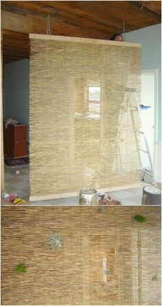 bamboo blinds are being installed on the wall in an unfinished room with wood flooring