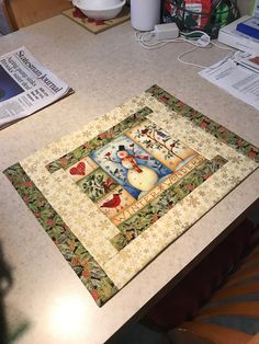 a kitchen counter top with a quilt on it