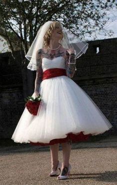 a woman in a white and red wedding dress