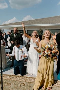 a bride and groom walking down the aisle