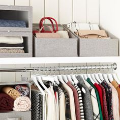 an organized closet with clothes and handbags