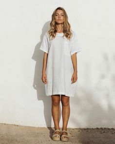 Easy breezy. That is the feeling you get when wearing a linen T-Shirt dress MIJAS in White. Perfectly balanced for summer strolls – it keeps you cool and protects your skin from s. Easy to style – wear it alone with sandals or sneakers, on a colder day – pair it with l linen pants.• T-shirt style dress • 2 side seam pockets, 1 front pocket • Medium weight linen (approx. 180 gsm) Casual Summer Linen Day Dress, Casual Linen Summer Dress For Daywear, Casual Linen Beach Dress, White Breezy Dresses With Relaxed Fit, White Breezy Dress With Relaxed Fit, Casual Short Sleeve Linen Summer Dress, Summer Linen Dress For Daywear, Summer Linen Dress With Short Sleeves For Day Out, Relaxed Fit Short Sleeve Linen Dress For Summer