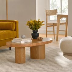 a living room filled with furniture and a yellow couch