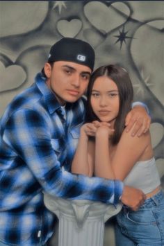 a man and woman are posing for a photo