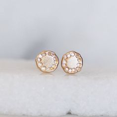 14k yellow gold Wildflower earrings on your choice of either 14k gold posts OR Sterling Silver posts. Handmade rounded gold discs hammered with a pattern reminiscent of a wildflower. Classic and modern, these are a little bit of luxury you can wear every day. Earrings are about 5.5-6mm's in diameter Posts ad ear backs - Choose between 14k gold or Sterling silver ear backs (the flower on both is 14k gold) Gold and Silver - Eco Friendly, Recycled Finish - Pictured with brushed finish, but can also 14k Yellow Gold Round Cluster Earrings, Gold 14k Diamond Earrings Gift, Delicate 14k Gold Round Earrings, Delicate Gold Cluster Earrings For Anniversary, Gold Diamond Earrings Stamped 14k For Wedding, Everyday 14k Stamped Yellow Gold Earrings, Delicate Gold Diamond Earrings For Everyday, Dainty Gold Round Diamond Earrings, Dainty Gold Cluster Earrings For Anniversary