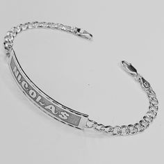 "Laser Deep Engraved.   Bracelet Script engraved.  Metal: Solid 925 Sterling Silver.  Chain type Bracelet: Curb Chain Diamond Cut.   Clasp Link: Lobster Claw lock.  Bracelet Chain Thickness: 4.8 mm.  ID Bar:  44 mm Wide X 8mm Hight. (Default) (Front: Max Font cursive script: 9 Letters.)        Deep Engraved ID Bracelet.  we can customize this jewelry bracelet with any name of your  choice and also determine the size of the bracelet in order to ensure that it is perfectly fitted on  your wrist. ( Personalized Gold Bracelet, Font Cursive, Flat Bracelet, Nameplate Bracelet, Nameplate Necklace Silver, Lock Bracelet, Fancy Script, Chain Diamond, Cursive Script