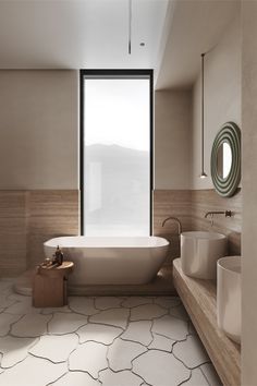 a bathroom with a large tub and two sinks