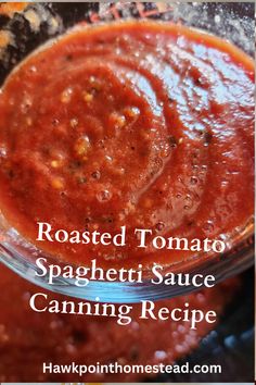 roasted tomato spaghetti sauce in a glass bowl with text overlay reading roasted tomato spaghetti sauce canning recipe