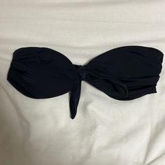 Size Small, Never Worn, Ties In The Front. Black Bandeau Seamless Swimwear, Black Seamless Bandeau Swimwear, Black Strapless Seamless Swimwear, Black Bandeau Tube Top For Swimming, Black Bandeau Tube Top For Beach, Black Strapless Tube Top For Poolside, Black Stretch Tube Top For Beach, Black Bandeau Swimwear For Swimming, Black Bandeau Swimwear For Pool