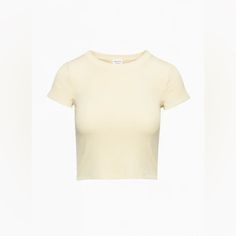 Nwot Wilfred Free By Aritzia Go-To T-Shirt In The Color Gd Pear Sorbet, A Creamy Light Yellow Color The One You Go To, And Go To, And Go To... This Is A Crewneck T-Shirt Designed For A Tight Fit. It’s Cut From Soft And Stretchy Ribbed Fabric Made With Tencel Modal Responsibly Sourced Wood-Based Fibres Produced Through A Process That Reduces Impact On Forests, Biodiversity And Water Supply. Fit: Tight A Close Fit That Hugs The Body Length: Waist Intended To Hit Between The Waist And High Hip Mate Yellow Fitted Crew Neck Top, Yellow Cotton Crew Neck Top, Yellow Cotton Short Sleeve Crop Top, Yellow Cotton Crop Top With Short Sleeves, Fitted Yellow Cotton Top, Fitted Yellow T-shirt For Summer, Fitted Yellow Summer T-shirt, Basic Yellow T-shirt For Spring, Basic Yellow Shirt For Summer