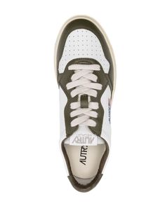 Medalist leather low-top sneakers from Autry featuring olive green, white, calf leather, two-tone design, perforated toebox, logo patch to the side, debossed logo to the rear, logo patch at the tongue, branded insole, round toe, front lace-up fastening and flat rubber sole. Size Info IT Color Detail Green Made In Indonesia Material Outer: Calf Leather 100% Sole: Rubber 100% Lining: Fabric 100%, Calf Leather 100% Season One Fall-Winter Season Two Fall-Winter Product sneakers Brand Autry Size And Latest Fashion Design, Crossbody Tote Bag, Moon Boots, Crossbody Tote, Sneaker Brands, Cool Socks, Small Leather Goods, Design Logo, Wallet Men