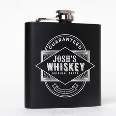 a black flask with white lettering on it and the words josh's whiskey