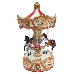 a merry go round carousel with horses on it